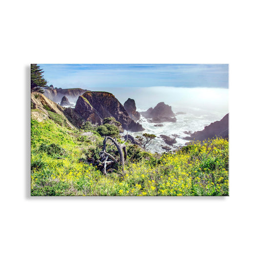 a scenic coastal landscape with rugged cliffs, lush vegetation, and a misty, hazy atmosphere over the ocean. Mendocino California Coast Art Print as Home Decor Gift
