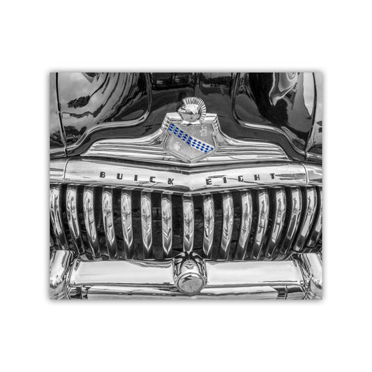 A close-up view of the front grille and hood of a classic Buick eight car, featuring the iconic Buick emblem and chrome grille. Buick Roadmaster Art Print | Vintage Car Black & White Photo