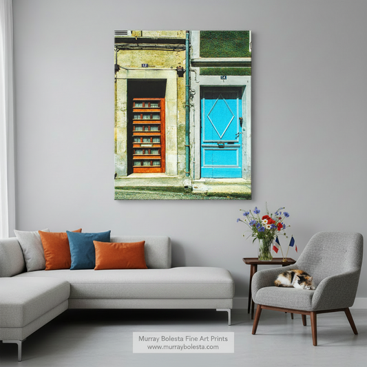 two doors, one blue and one orange, located on a building with a stone facade. French Village Street Photography Print | Bazas Blue Door Art by Murray Bolesta!