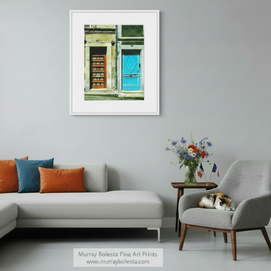 two doors, one blue and one orange, located on a building with a stone facade. French Village Street Photography Print | Bazas Blue Door Art by Murray Bolesta!