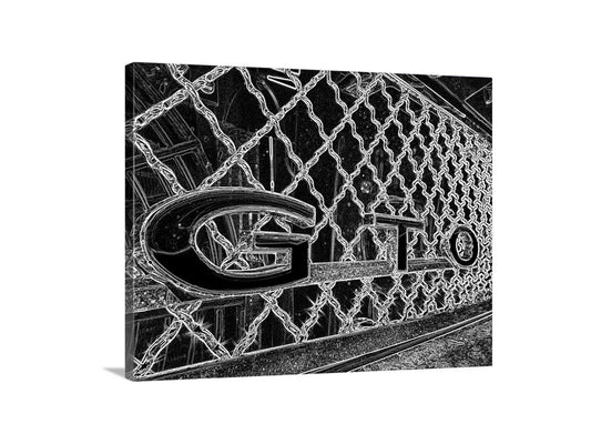 a close-up view of a chain-link fence with the word "GTO" prominently displayed in the center. Pontiac GTO Black & White Muscle Car Art Print Wall Decor