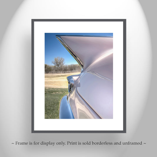 a close-up view of the rear end of a car, showcasing its sleek design and shiny exterior. Classic Cadillac Eldorado Artwork by Murray Bolesta
