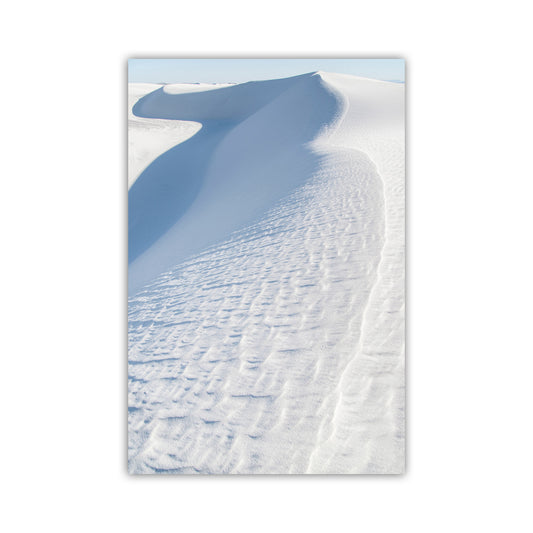A snow-covered landscape with a large, curving dune in the distance. Minimalist Sand Dune Print - Pale Blue White Sands Photography Art