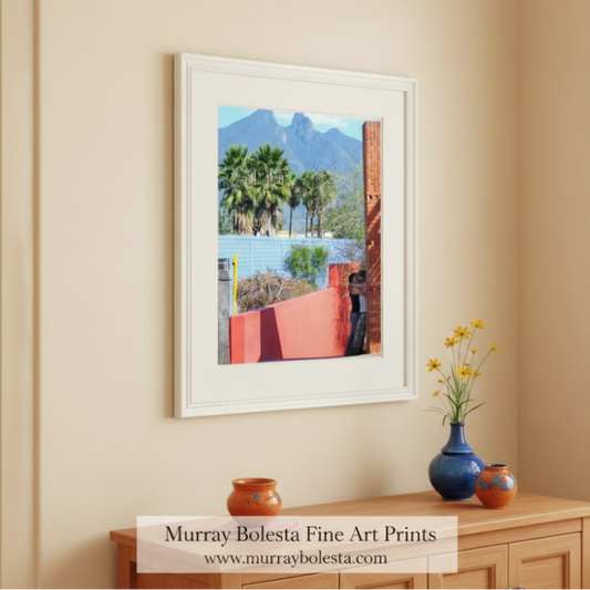 Scenic view with palm trees, mountains, and a person taking a photo. Monterrey Mexico by Murray Bolesta