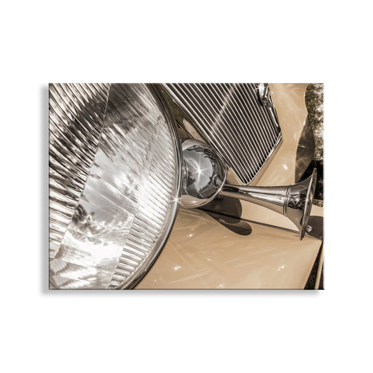 a close-up view of a chrome headlight and a chrome grille, showcasing the intricate details and textures of these automotive components. Antique Car Sepia Art Print | Abstract Vintage Automotive Decor