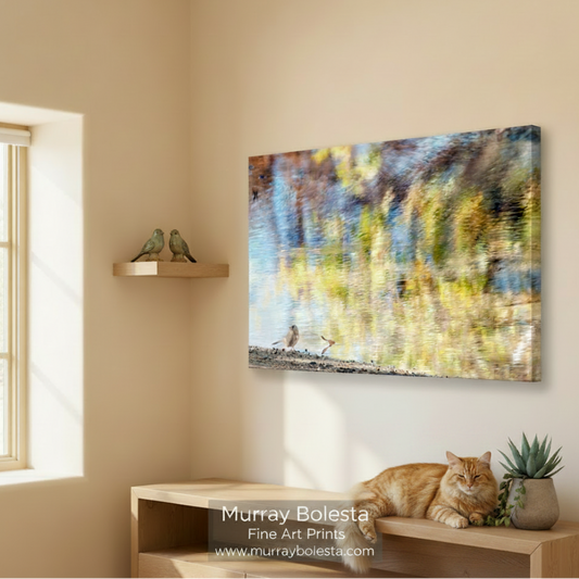 A blurry, colorful landscape with a bird standing on the ground near a body of water. Painterly Bird & Water Reflections - Arizona Fall Colors Art Print by Murray Bolesta