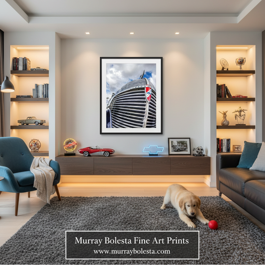 A framed wall art print depicting a close-up of a black and white striped car hood with a Union Jack flag, displayed in a modern living room setting with a dog on a gray rug.