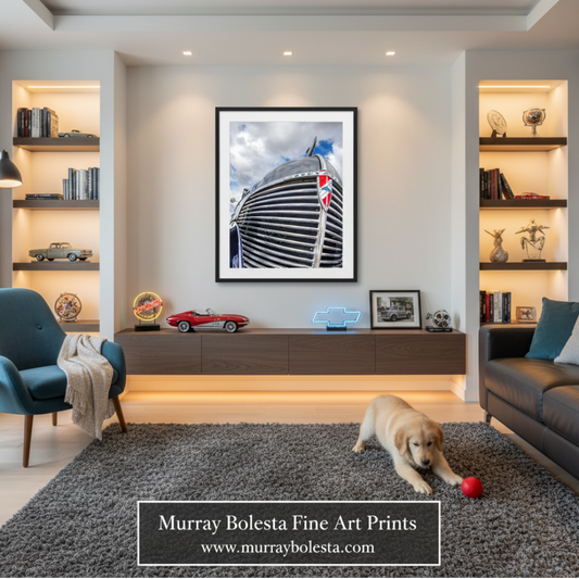 A framed wall art print depicting a close-up of a black and white striped car hood with a Union Jack flag, displayed in a modern living room setting with a dog on a gray rug.