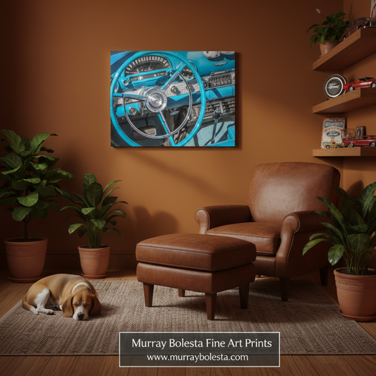 A framed wall art print showing a vintage blue car steering wheel and dashboard, displayed in a warm brown living room above a brown leather armchair and ottoman. A dog lies on the rug nearby, with potted plants and wooden shelves in the room.