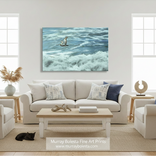 A seagull soars above the crashing waves of the ocean, its wings spread wide as it glides effortlessly above the foamy water. Flying Pelican Art | Pacific Ocean San Diego California Print by Murray Bolesta