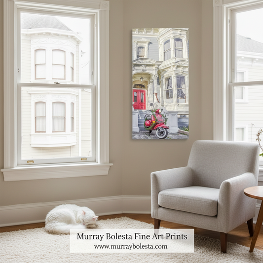San Francisco Christmas by Murray Bolesta. A vertical canvas art print depicting a vintage red scooter on a street in front of a Victorian house, displayed on a beige wall in a styled living room with a gray armchair, a white cat on the rug, and large windows.