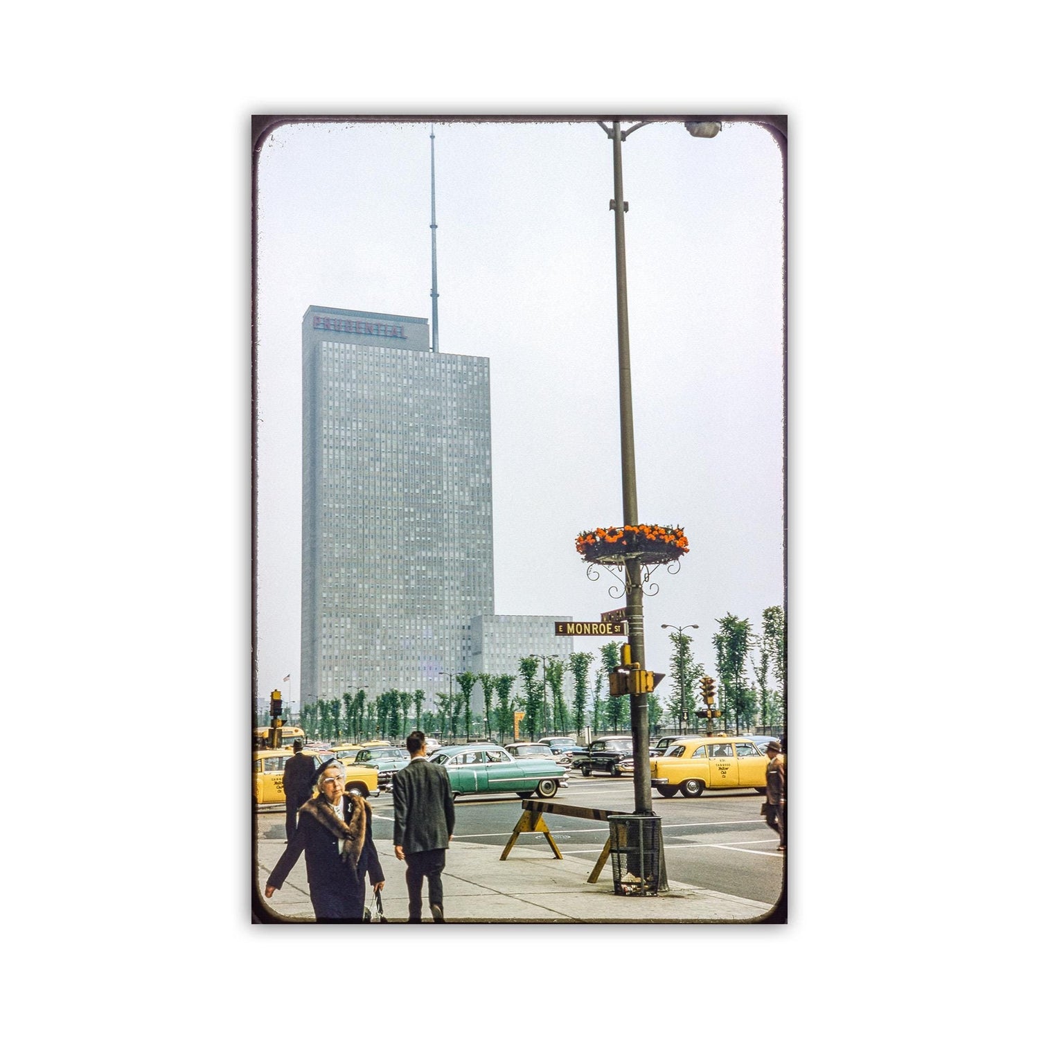 a busy city street with tall buildings, cars, and pedestrians. Chicago Prudential Building Art - Vintage Mid-Century Street Photo