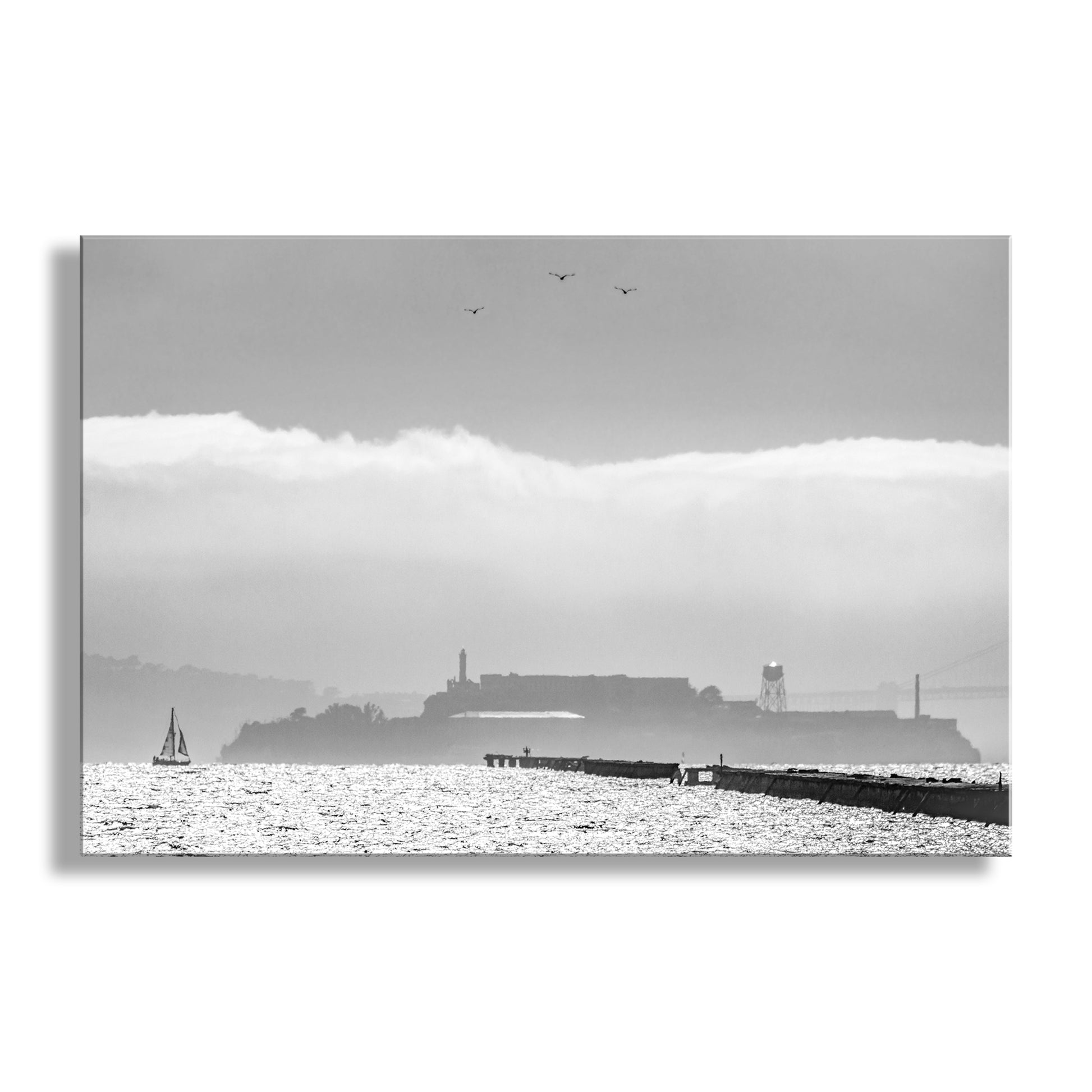 My splendid black &amp; white San Francisco Bay California photograph: Alcatraz Island and Berkeley Pier, with a sailboat, seagulls, ocean fog 'n' all! This famous prison island is today one of San Francisco's top tourist destinations. The pier was once miles long! Original, unique signed art by Murray Bolesta.