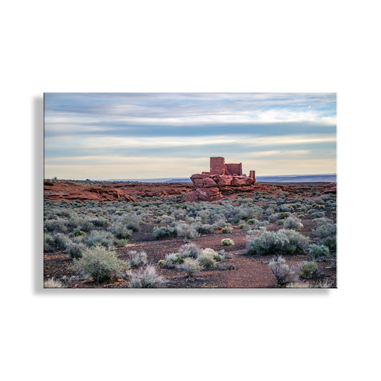 Desert landscape with a prominent red rock formation under a blue sky. Native American Cliff Dwelling Picture in Arizona Red Rock Desert Landscape