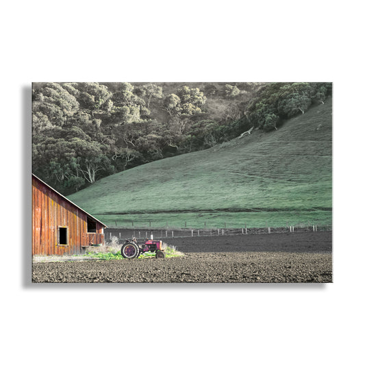 Wooden barn with a red tractor on a plowed field with green hills in the background. Red Barn & Old Tractor in Lompoc California Farm Landscape | Santa Barbara County