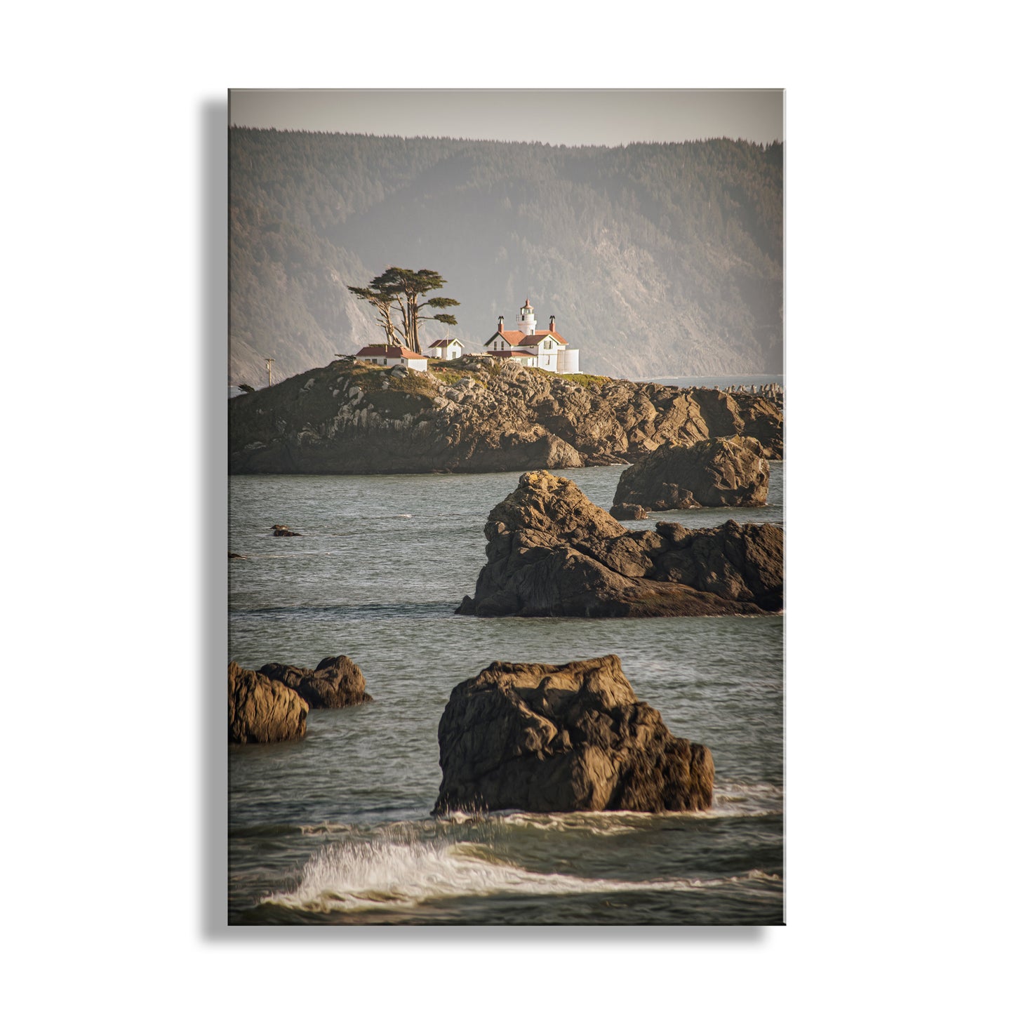 Lighthouse on a rocky outcropping with ocean waves in the foreground. Beautiful Crescent City! For your walls, my cool lighthouse art of Crescent City California. In the heart of Northern California's redwood coast, it's Del Norte County and the North Coast. This was one of the earliest lighthouses constructed on the USA West Coast, soon after California became a state! Original, unique signed art photograph by Murray Bolesta.