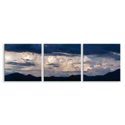 Triptych of mountain landscape with clouds on a white background. Bold Wall Decor with Indigo Blue Storm Clouds Set of 3 square Pictures