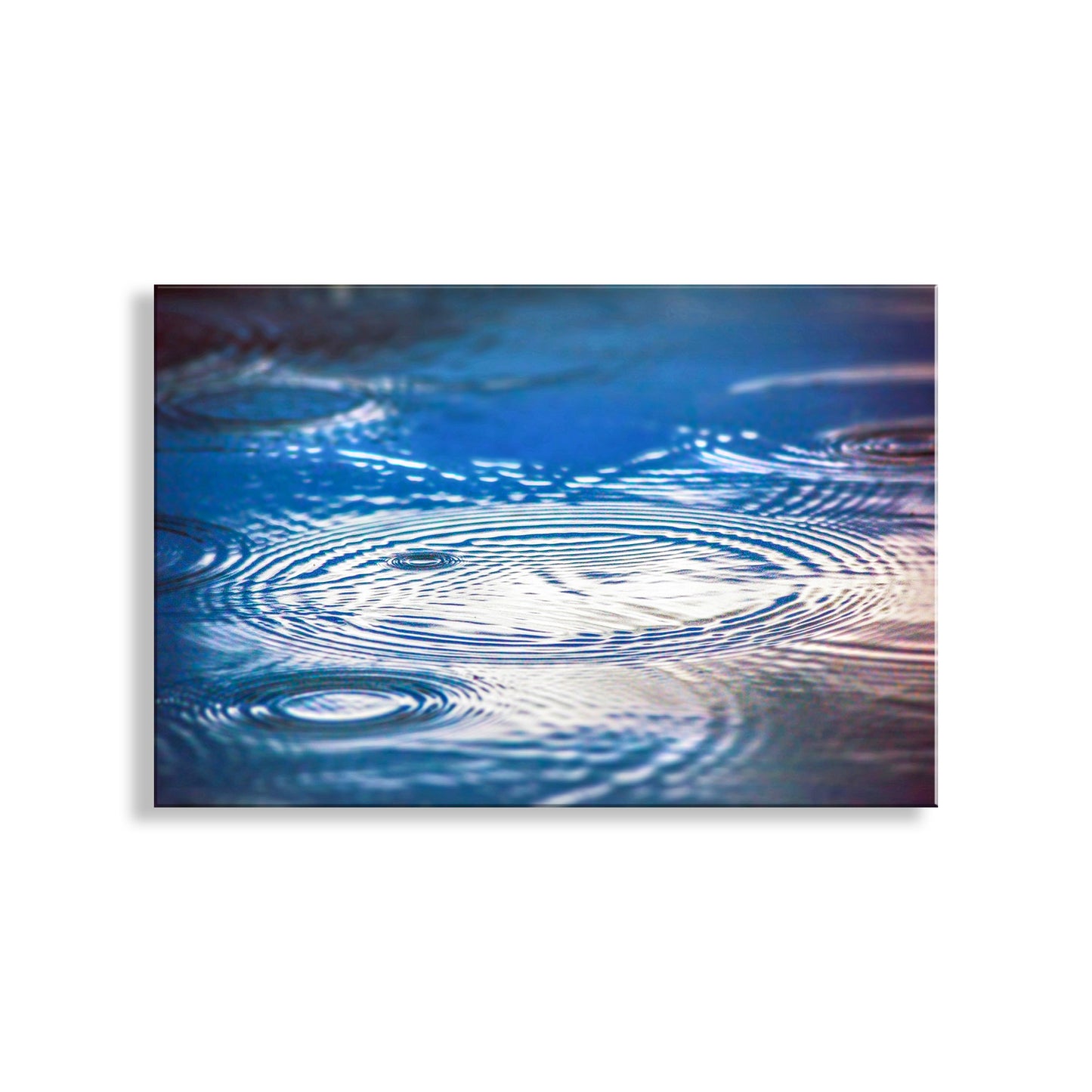 Ripples on water surface with a white background. Fine Art Nature Print for Home with Indigo Blue Water Art with RaindropsFine Art Nature Print for Home with Indigo Blue Water Art with Raindrops