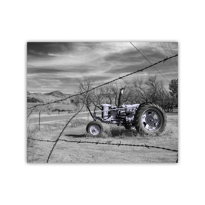 Vintage tractor in a field with barbed wire and cloudy sky. Rustic Farm Wall Art – Vintage Blue Tractor Print, Arizona Countryside