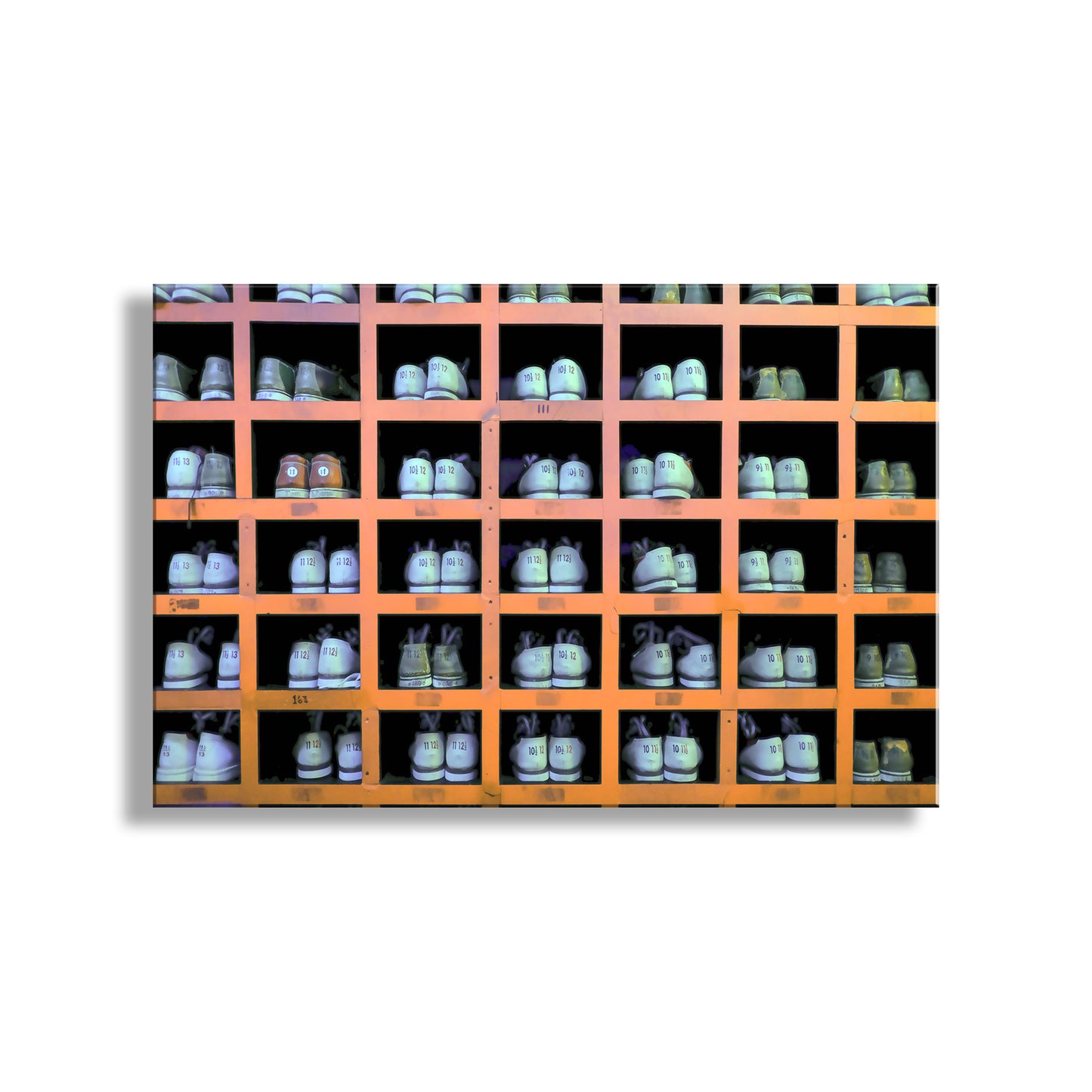 Wall-mounted shoe rack with multiple pairs of shoes displayed in rows. Bowling Art Photography Print with Bowling Shoes