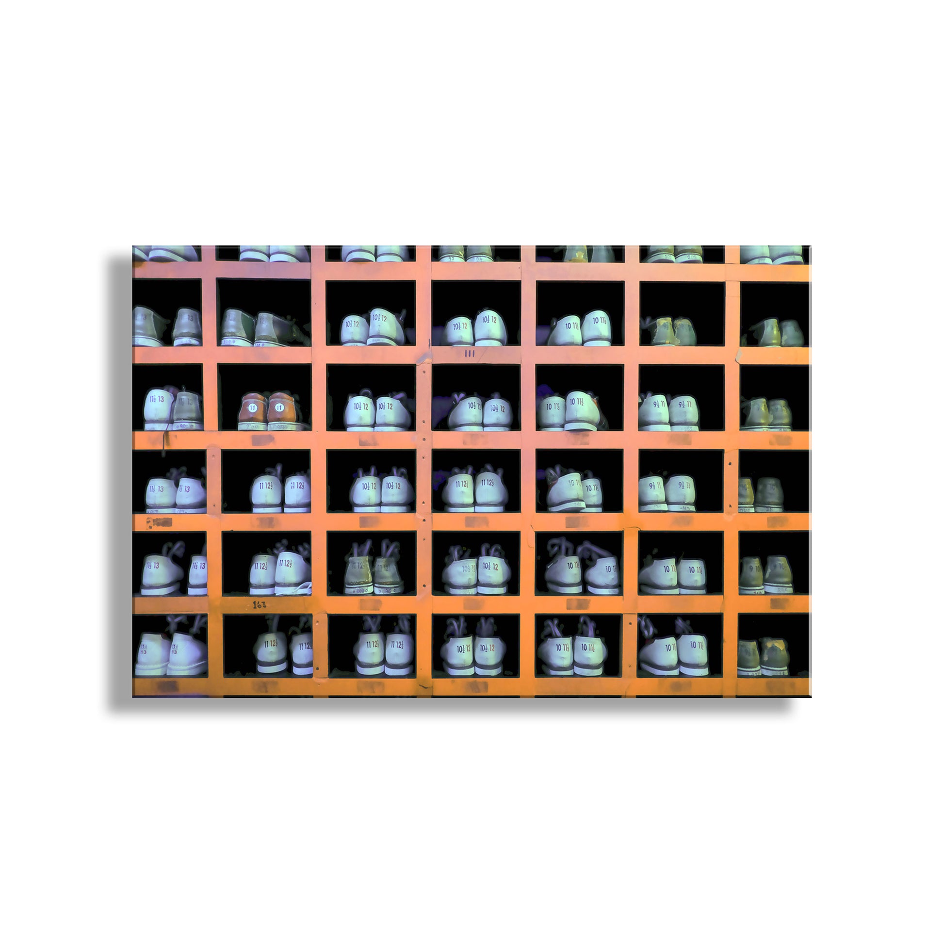 Wall-mounted shoe rack with multiple pairs of shoes displayed in rows. Bowling Art Photography Print with Bowling Shoes