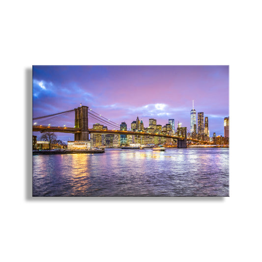 Brooklyn Bridge and Manhattan skyline at dusk with a purple sky. NYC Skyline Art Print | Brooklyn Bridge East River Sunset & Jane's Carousel at Dusk