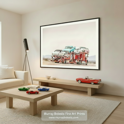 A red and white car carrier is transporting a collection of vintage cars, including a white car, a blue car, and a white car, on a desert road. Road Trip Car Photography – Mid-Century Cars Art Print by Murray Bolesta