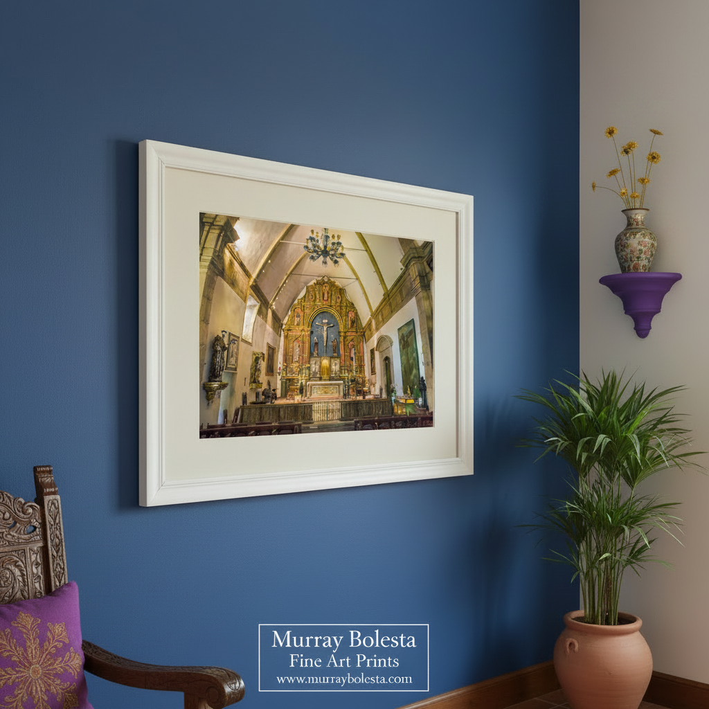 a large, ornate church interior with a high vaulted ceiling, chandeliers, and a large altar with religious statues and decorations. Carmel Mission Interior Photo – Vintage Church Architecture Art Print by Murray Bolesta