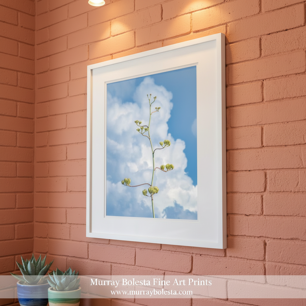 Floral branch against a blue sky with white clouds. Desert Agave Pastel Wall Art with Arizona Century Plant and Clouds by Murray Bolesta