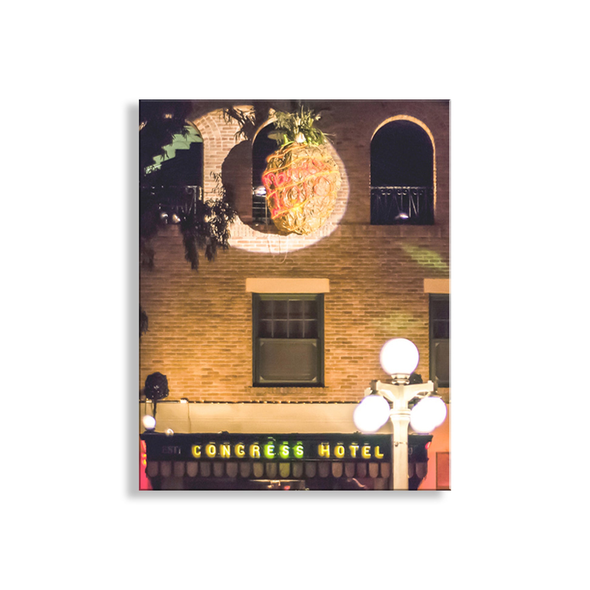 Framed photograph of a building with a pineapple sculpture and 'Congress Hotel' sign. Tucson Arizona Hotel Congress at Night Wall Photo Art Print