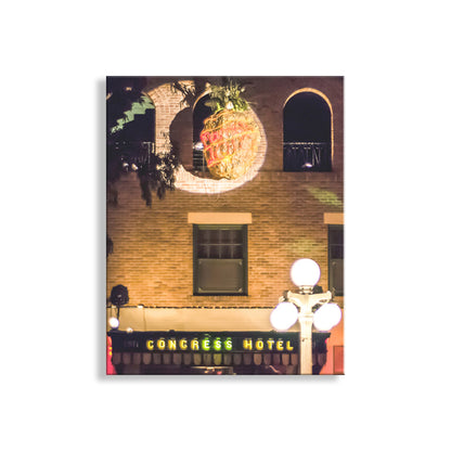 Framed photograph of a building with a pineapple sculpture and 'Congress Hotel' sign. Tucson Arizona Hotel Congress at Night Wall Photo Art Print