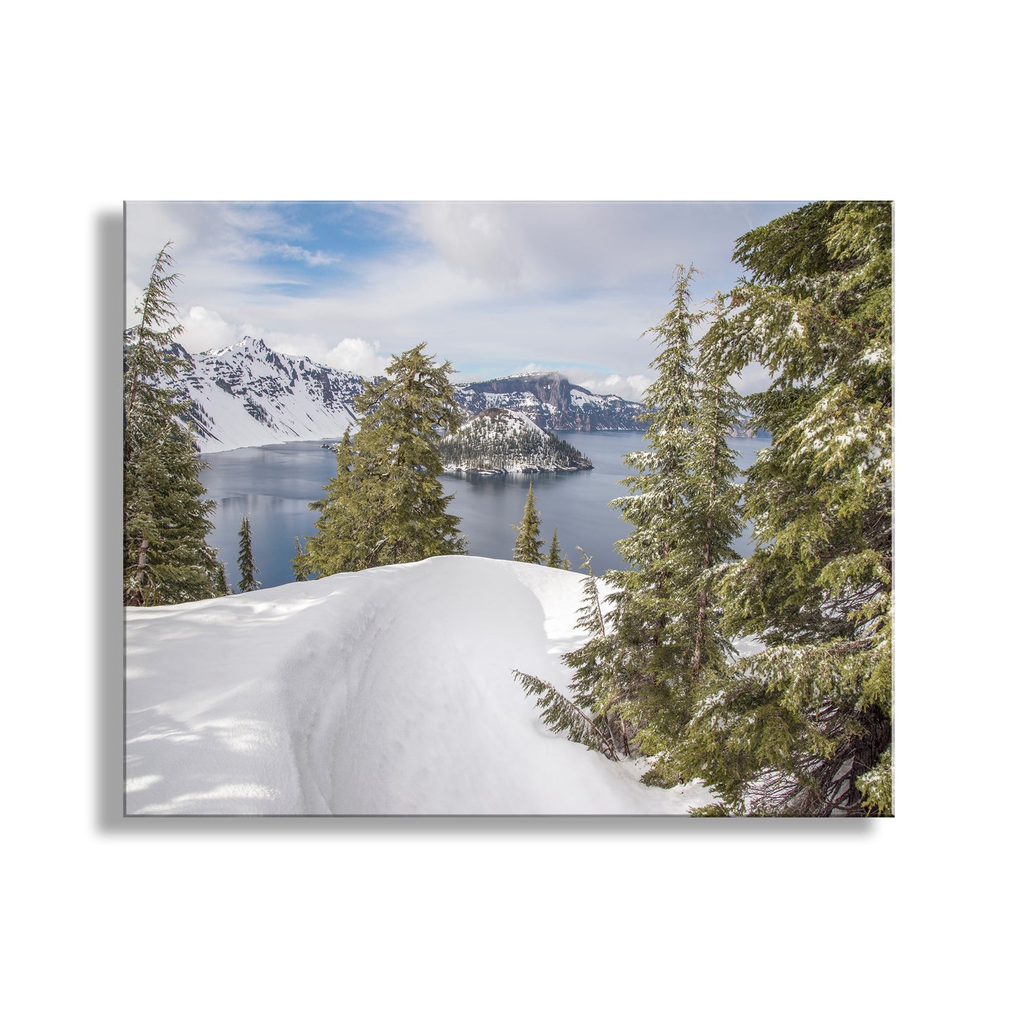 Winter landscape with snow-covered ground, trees, and a lake with mountains in the background. A Cascade Mountain volcano! Precious and unique Crater Lake, Oregon, USA, a Pacific Northwest gem to be loved and protected! I captured this image in early Spring. Original, unique signed art by Murray Bolesta.