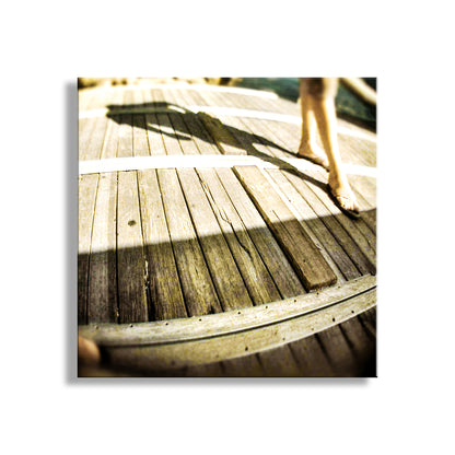 Wooden deck with sunlight casting shadows on the surface. Surreal Photography with San Diego Ocean Wharf Picture at Dock of the Bay