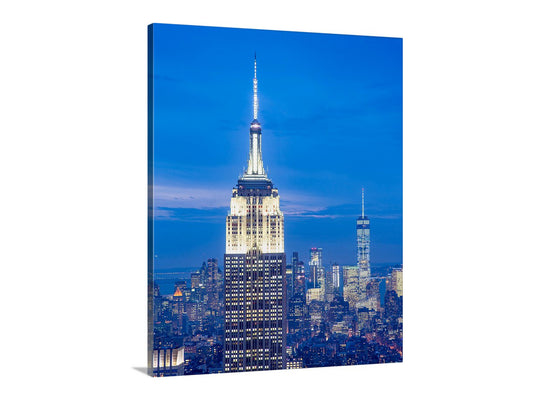 Canvas print of the Empire State Building at night with a blue sky. Empire State Building at Night | New York City Cityscape Photograph