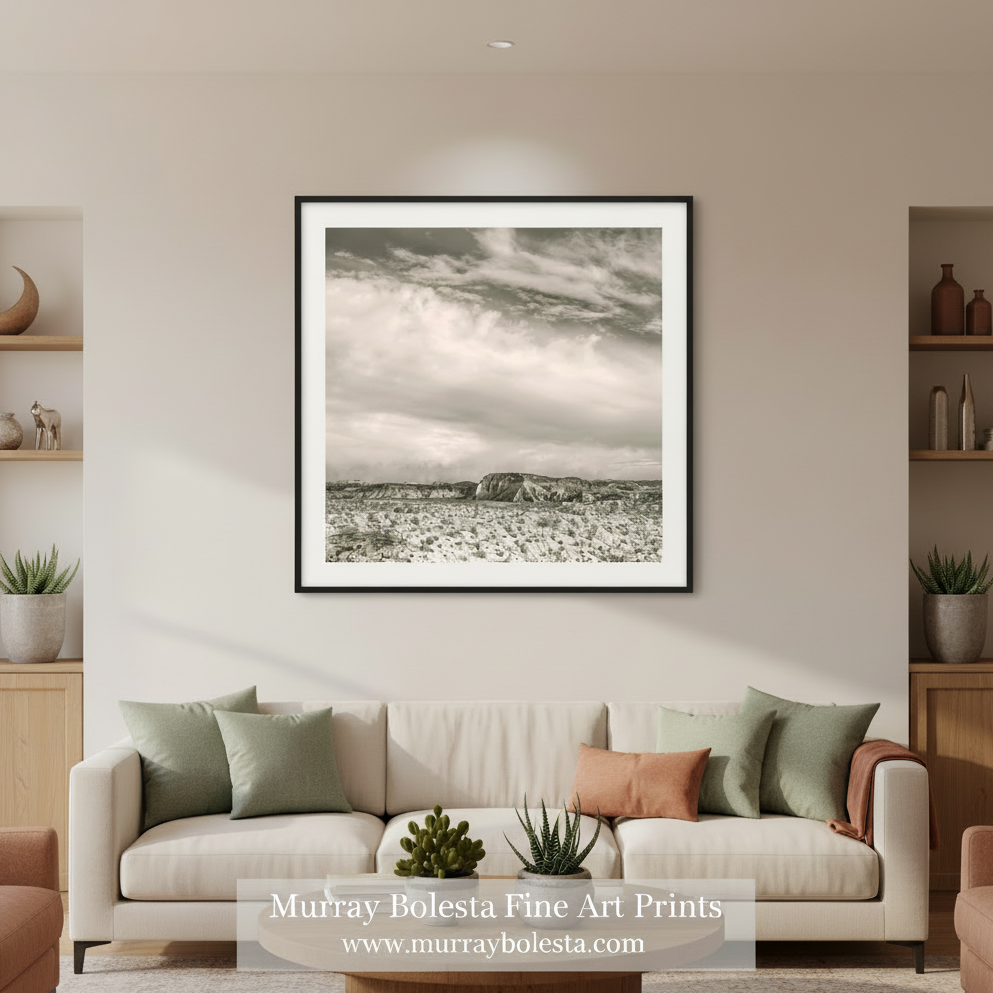 Desert landscape with a large rock formation under a cloudy sky by Murray Bolesta - UTAH!