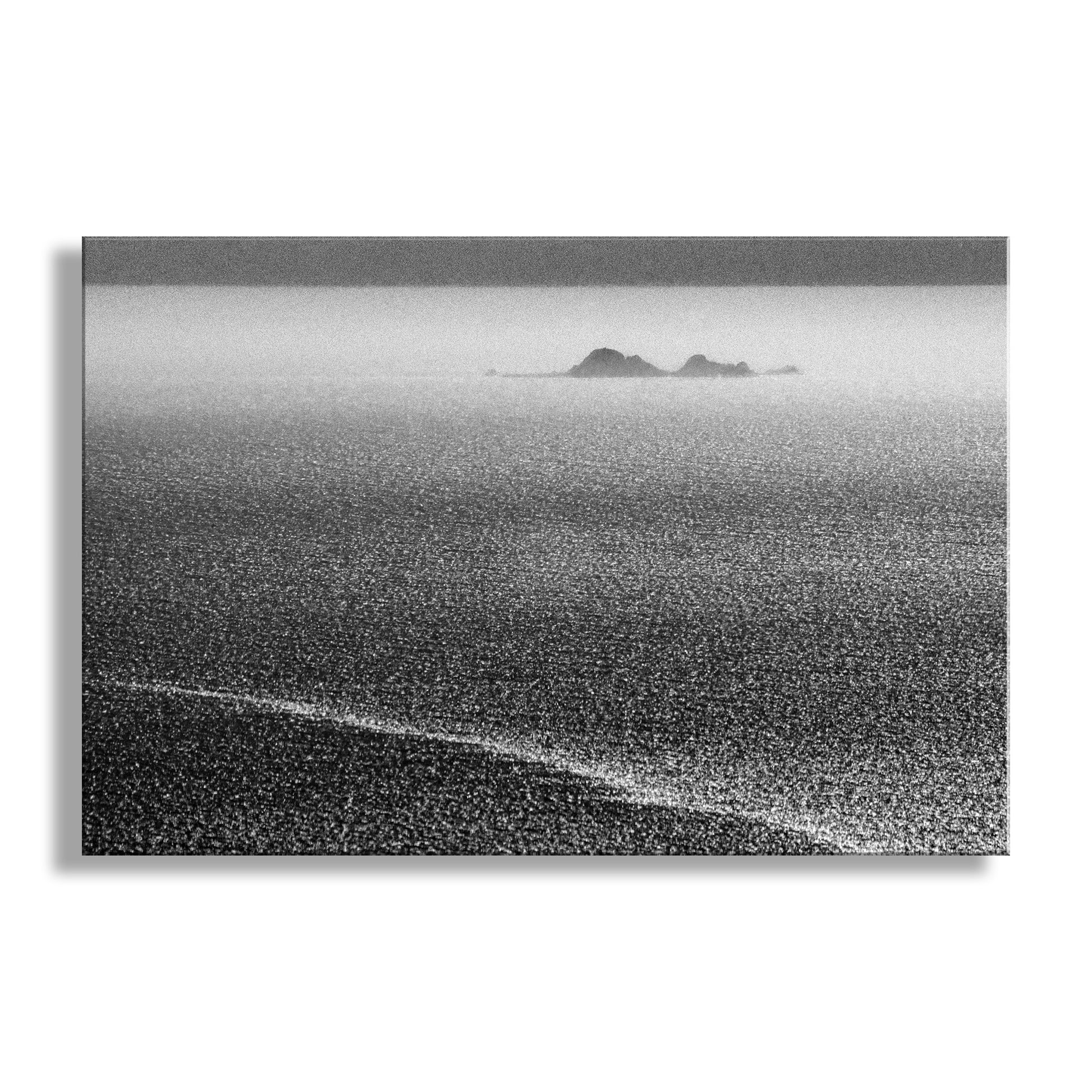 Black and white landscape of ocean with distant islands.  My beautiful black and white ocean photography for your pleasure: California's Farallon Islands float on the far horizon like an apparition, with a tide line in the foreground to boot! I captured this scene from Mount Tamalpais on a brilliant spring afternoon. Original, unique signed art by Murray Bolesta.