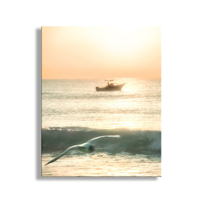 Boat on water with a whale in the foreground at sunset. Rhode Island Beach Sunrise Artwork with Fishing Trawler Boat & Seagull