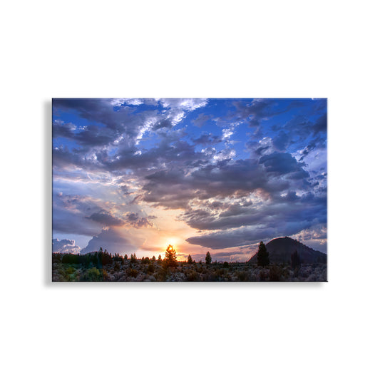 Sunset over a mountain landscape with large clouds. Western Sunset Photograph at Lava Beds National Monument
