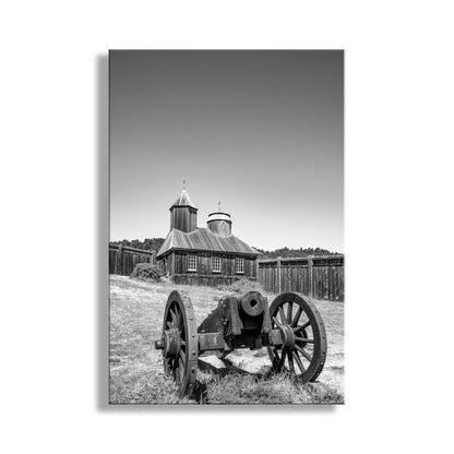 Black and white photo of an old building with a large wheel in front. My beautiful Fort Ross picture on a gorgeous spring day! In the background of this image is the Russian Orthodox Chapel, reconstructed twice due to fires. Fort Ross was the southernmost hub of Russian colonial activity in the early 1800s.&nbsp; Original, unique signed art by Murray Bolesta!