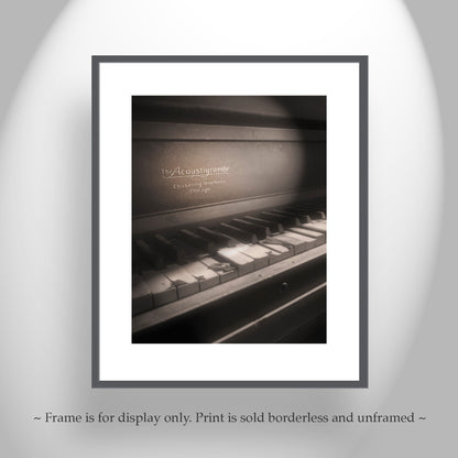 Framed print of a piano keyboard with 'The Acoustigrande' branding on a gray background. Chickering Piano Surreal Art from Ruby Arizona Ghost Town