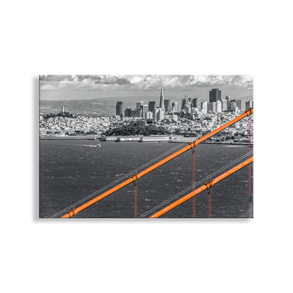 City skyline with a prominent orange structure, likely a bridge, in the foreground. My San Francisco California artwork with the Golden Gate Bridge for your walls! My sweeping San Francisco Bay photo art skyline: the fabulous 1937 Golden Gate Bridge, framing everyone's favorite city. A tour boat motors in the distance. Original, unique signed art by Murray Bolesta!