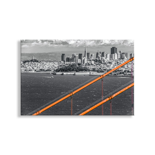 City skyline with a prominent orange structure, likely a bridge, in the foreground. My San Francisco California artwork with the Golden Gate Bridge for your walls! My sweeping San Francisco Bay photo art skyline: the fabulous 1937 Golden Gate Bridge, framing everyone's favorite city. A tour boat motors in the distance. Original, unique signed art by Murray Bolesta!