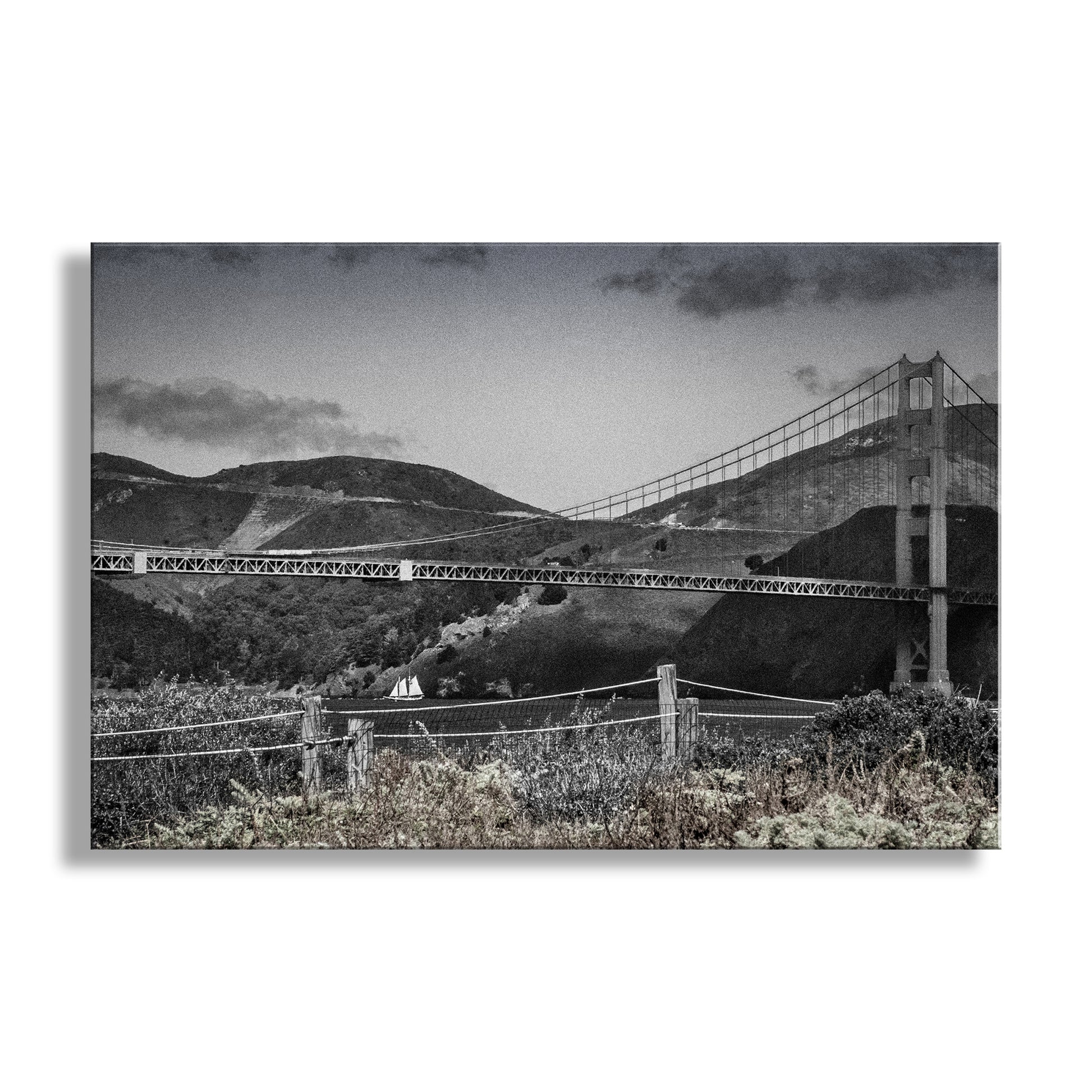 Mighty Marin Headlands! My unique Golden Gate Bridge art for your walls: the giant bridge at the center of a scene with Marin County and a graceful sailboat. I captured this image from the precious restored dunes &amp; native wildflowers of the Presidio of San Francisco National Park! This photograph features muted gray tones with a hint of color, and artful grain. Original, unique signed art by Murray Bolesta.
