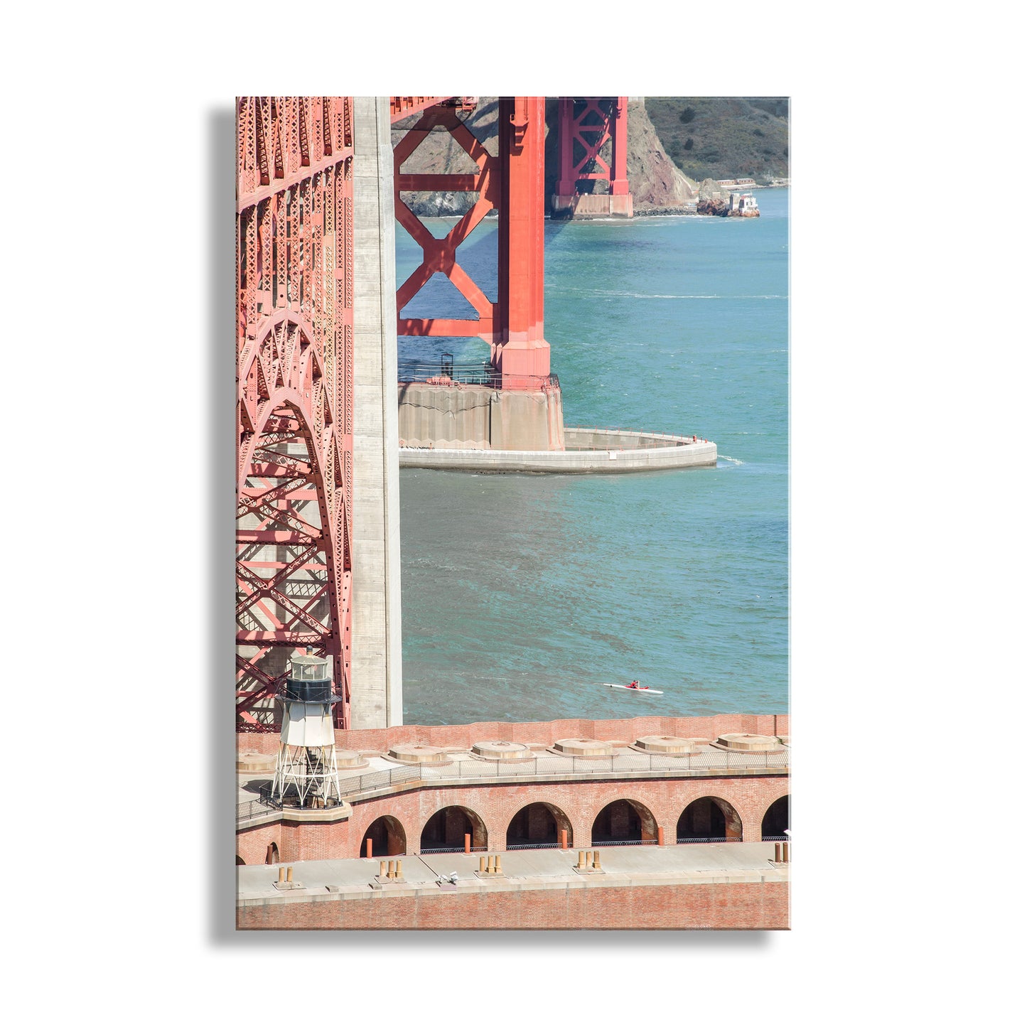 Framed photograph of the Golden Gate Bridge with a white border. Fabulous Fort Point. My kool kayaking picture at the Golden Gate Bridge. Here, the colossal bridge and historic Fort Point dwarf a lone sea kayaker in the San Francisco Bay! Original, unique signed art by Murray Bolesta.