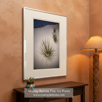 a serene landscape with a white sandy hillside dotted with small green plants or grasses, creating a sense of tranquility and natural beauty. Yucca Agave Desert Print - White Sands New Mexico Botanical Wall Art by Murray Bolesta