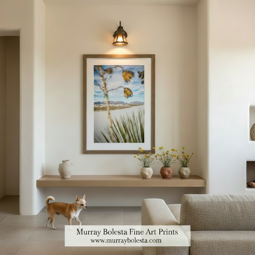 a desert landscape with a tall, thin tree branch in the foreground and a distant mountain range in the background. Yucca Agave Plant Print - White Sands New Mexico Desert Landscape Art by Murray Bolesta