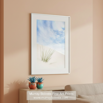 A single green plant growing in a vast, white sand dune against a backdrop of a blue sky with wispy clouds. Minimalist Desert Print - White Sands New Mexico Gypsum Dunes Art by Murray Bolesta