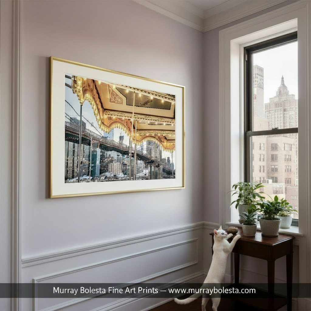 A carousel with lights and a bridge in the background, with a city skyline visible through the carousel's windows. Janes Carousel Brooklyn Bridge NYC Art Print | New York City Art Gift by Murray Bolesta