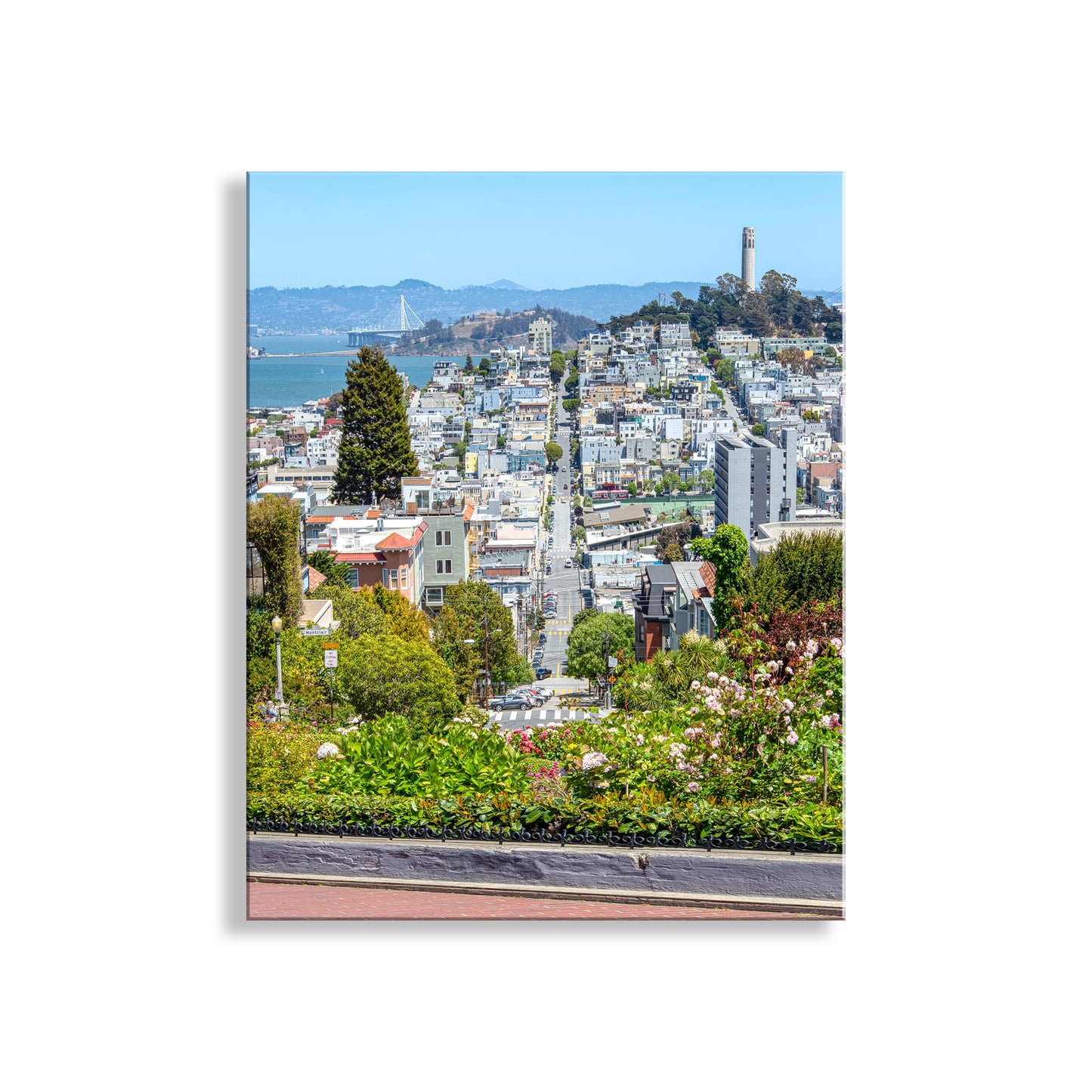 Cityscape with buildings, trees, and a clear sky.Beautiful California! For your walls, my splendid colorful San Francisco art print of famous Lombard Street looking east. Original, unique signed art by Murray Bolesta.
