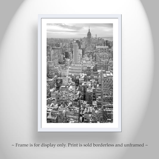 Framed black and white cityscape print on a light gray wall. New York City Empire State Building Black & White Photography